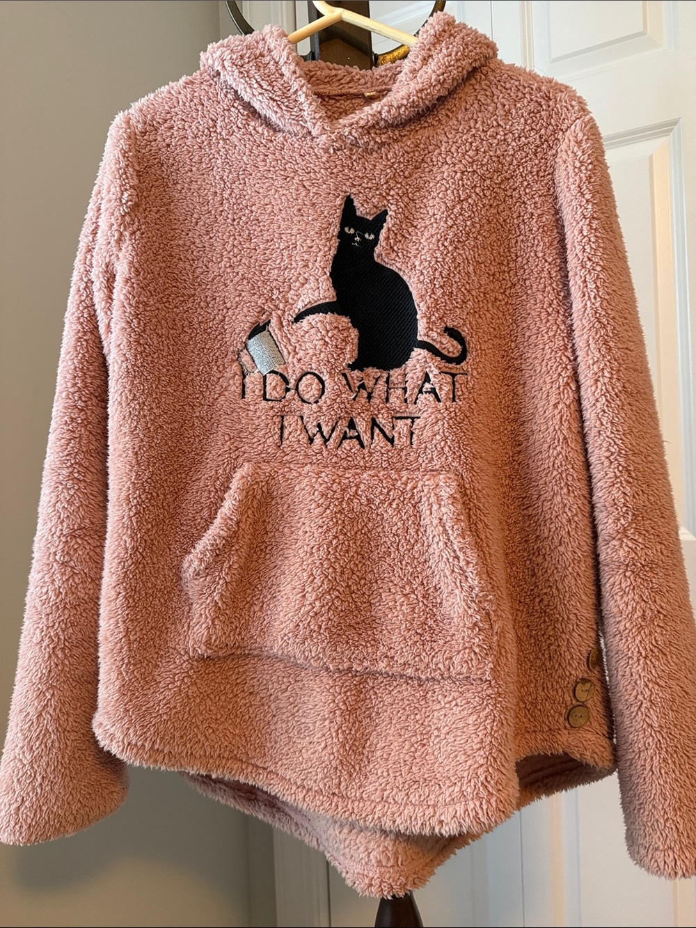 Fluffy light pink sweatshirt with hood and kangaroo pocket